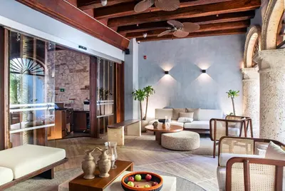 a living room with a couch and a table at Hotel Casona del Porvenir in Cartagena de Indias