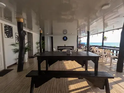 a dining room with a table and chairs on a boat at Gafitas in Playa Blanca