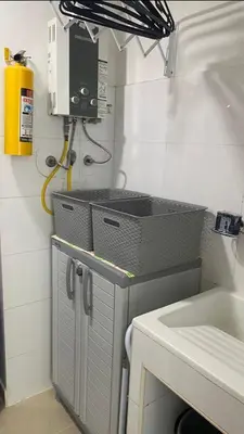 a small kitchen with a sink and a microwave at apartamento en bocagrande in Cartagena de Indias