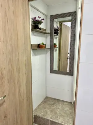 a bathroom with a mirror and a walk in shower at CARTAGENA LA FANTASTICA in Cartagena de Indias