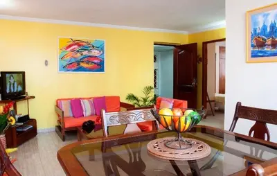 a living room with a glass table in a room at II-Nice and cozy 2 bedroom Apt BOCAGRANDE in Cartagena de Indias