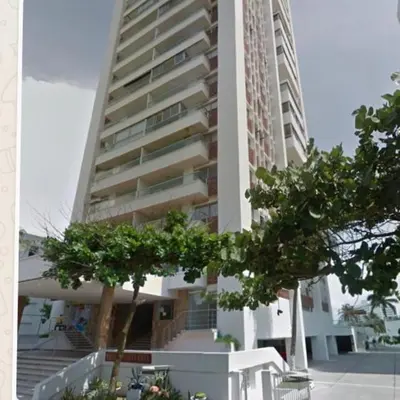 a tall building with trees in front of it at I-Nice 1 Bedroom Apt Laguito in Cartagena de Indias