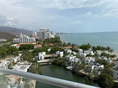 a view of a city with a river and buildings at Edificio Sierra Beach Resort Pozos Colorados vista y salida al mar in Santa Marta