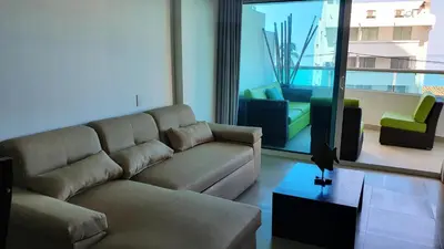 a living room with a couch and a tv at Apartamento en el Sector El Laguito in Cartagena de Indias