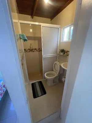 a bathroom with a shower and a toilet and a sink at Casa 39-33 in Cartagena de Indias