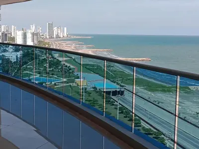 a view of the ocean from the balcony of a building at Pent House 450 mts 360 front ocean view playa azul in Cartagena de Indias