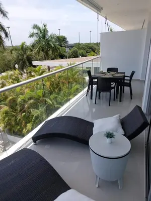 a balcony with a table and chairs and a table at Apartamento Morros vitri 214 zona norte in Cartagena de Indias