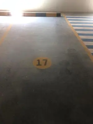 a yellow number on the floor of a parking lot at Apartamento El Laguito Cartagena in Cartagena de Indias