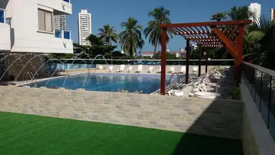 a swimming pool in a building with a resort at Apartamento en Cartagena Colombia in Cartagena de Indias