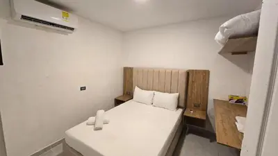 a small room with a bed in a room at Oceanfront loft in high level neighborhood in Cartagena de Indias