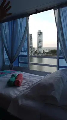 a bedroom with a bed with two pillows on it at Excelente vista al mar in Cartagena de Indias