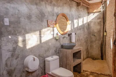 a bathroom with a toilet and a sink at La Playita Isla Fuerte in Isla Fuerte