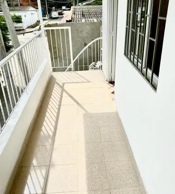 a shadow of a railing on a porch at Apartamentos Rincón Garcia in Cartagena de Indias