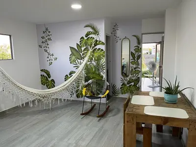 a room with a table and a mirror and plants at Apartamento Cómodo y encantador en cartagena in Cartagena de Indias