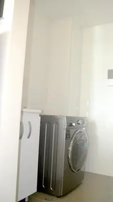 a kitchen with a stainless steel refrigerator in a room at Las Margaritas, Loft en Distrito 90 in Barranquilla