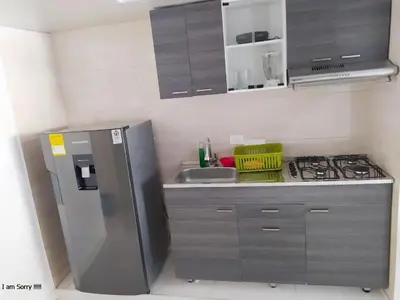 a kitchen with a stainless steel refrigerator and a sink at APT cercano centro Histórico N - Marbella O in Cartagena de Indias