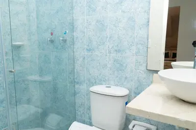 a bathroom with a shower and a toilet and a sink at Casa Badillo 2 OLD CITY CRAZY LOCATION 4br jacuzzi wifi Ac hottub in Cartagena de Indias