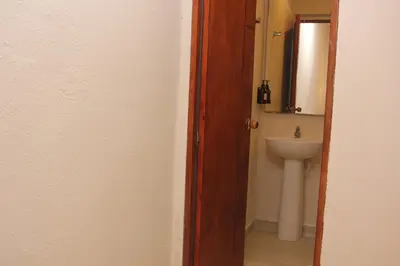a bathroom with a toilet and a sink at Casa Moneda 1 5BR amazing house picusi AC old city in Cartagena de Indias
