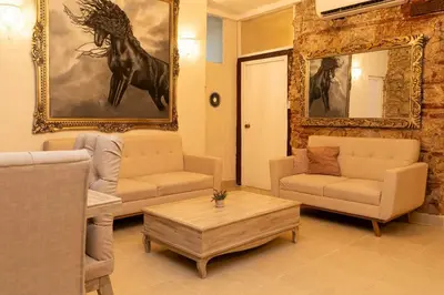 a living room with a couch and a coffee table at Casa Quero 914, 3br Old city wifi jacuzzi in Cartagena de Indias