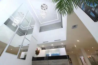 a large building with a ceiling with glass at Hotel Oxford Barranquilla in Barranquilla
