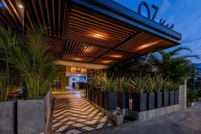 a house with a wooden roof with plants at Oz Hotel Cartagena in Cartagena de Indias