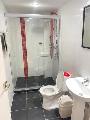 a bathroom with a shower and a toilet and a sink at Cabrero Beach 1111 in Cartagena de Indias