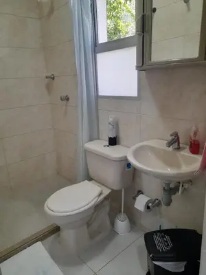a bathroom with a toilet and a sink at Apartaestudio Cartagena 2P in Cartagena de Indias