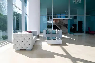 a living room with white furniture in a building at 1 Dormitorio con salida directa playa de Morros in Cartagena de Indias
