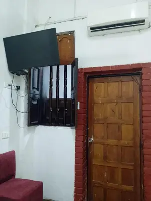 a door to a room with a fan and a window at Hostal #10-33 in Cartagena de Indias