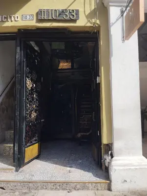 an entrance to a store with the door open at Hostal #10-33 in Cartagena de Indias