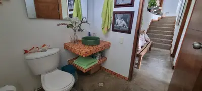 a bathroom with a toilet and a stairwell with a staircase at Nuestra Casa in Tubará