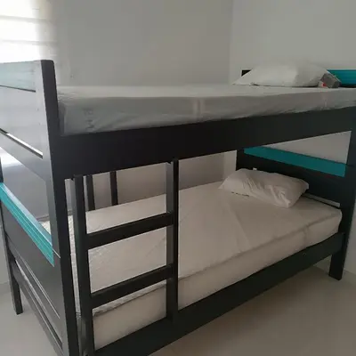 a couple of bunk beds in a room at Casa Para 3 a 12 personas in Cartagena de Indias
