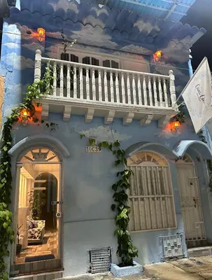 a house with a balcony on the side of it at Casa Cielo Cartagena in Cartagena de Indias