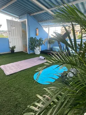 a room with a yoga mat on the grass at Casa Cielo Cartagena in Cartagena de Indias