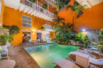 a swimming pool in a room with a building at Amazing Colonial Mansion Old City Cartagena in Cartagena de Indias