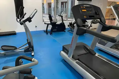 a gym with several treadmills and a treadmill at 212 Cartagena Walled City Magical Apt in Cartagena de Indias