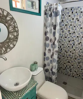 a bathroom with a sink and a toilet and a shower at Mio Mio Beach in Baru