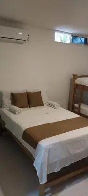 a bedroom with a large bed in a room at Cabañas Berakah in Coveñitas