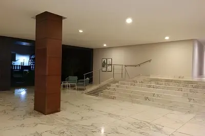 a lobby with stone stairs and a pillar at Apartamento 1 Dormitorio Morros. Vista Mar Piscina in Cartagena de Indias