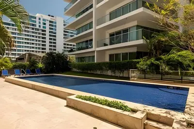 a swimming pool in front of a building at Apartamento 1 Dormitorio Morros. Vista Mar Piscina in Cartagena de Indias