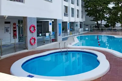 a pool in a building with two swimming pools at Hermoso apartamento cerca del centro histórico in Cartagena de Indias