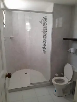 a bathroom with a shower and a toilet at Condominio en la Playa de Crespo in Cartagena de Indias