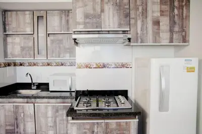 a kitchen with a stove top oven in a kitchen at Linda vista y excelente ubicación in Cartagena de Indias