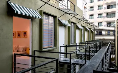 a balcony with black and white awnings at OASIS TROPICAL HOTEL in Santa Marta