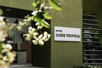 a sign on the side of a building that reads invalid class therapeutic at OASIS TROPICAL HOTEL in Santa Marta