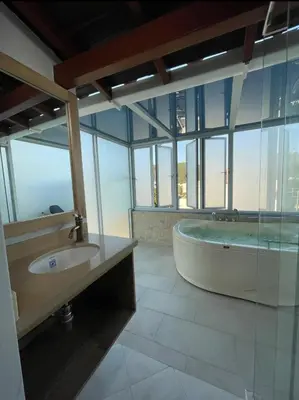 a large bathroom with a tub and a sink at Hotel El Faro - Desayunos incluidos - Manga, Cartagena in Cartagena de Indias