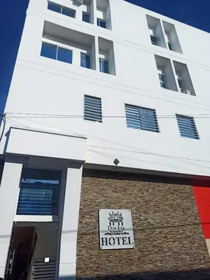 a building with a hotel sign in front of it at Hotel Don Jose in Ciénaga
