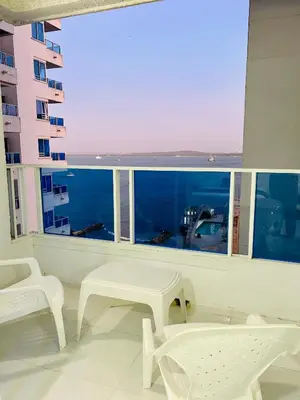 a white room with a view of the ocean at Apartaestudio in Cartagena de Indias
