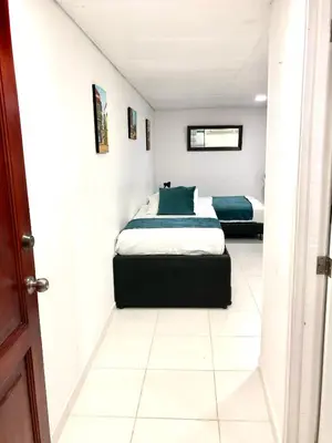 a bedroom with two beds in a room at Apartaestudio in Cartagena de Indias