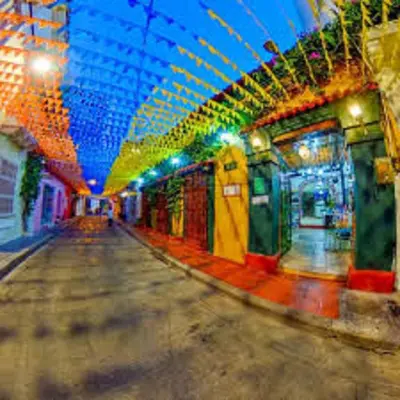 a subway station with a train with colorful lights at 2CB-4 APARTAMENTO DE 2 ALCOBAS EN EL CENTRO HISTORICO CON AIRE ACONDICIONADO Y WIFI in Cartagena de Indias